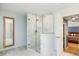 Modern bathroom featuring a glass shower with marble surround and open access to the bedroom at 656 Gunby Se Rd, Marietta, GA 30067