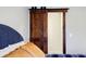 Bedroom with a rustic sliding barn door to a closet at 656 Gunby Se Rd, Marietta, GA 30067