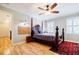 Bright bedroom with hardwood floors, natural light, and a view to the hallway at 656 Gunby Se Rd, Marietta, GA 30067