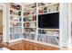 Spacious built-in bookcase with a TV and storage for books and records at 656 Gunby Se Rd, Marietta, GA 30067