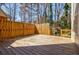 Expansive wooden deck perfect for outdoor entertaining, bathed in sunlight with a private fenced perimeter at 656 Gunby Se Rd, Marietta, GA 30067