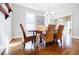 Dining room with hardwood floors, shelving, and an airy feel at 656 Gunby Se Rd, Marietta, GA 30067