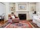 Cozy fireplace with built-in shelves on either side, complemented by a patterned rug at 656 Gunby Se Rd, Marietta, GA 30067