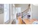 Inviting foyer with hardwood floors, staircase, and arched front door with decorative glass panes at 656 Gunby Se Rd, Marietta, GA 30067