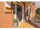 Close up of the front door, brick facade and welcome sign at 656 Gunby Se Rd, Marietta, GA 30067