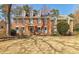 Traditional red brick home with dormer windows and manicured lawn at 656 Gunby Se Rd, Marietta, GA 30067