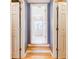 Hallway leading to a luxury bathroom featuring a standalone tub at 656 Gunby Se Rd, Marietta, GA 30067