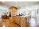 Open kitchen with a granite island, stainless appliances, hardwood flooring and an adjacent dining area at 656 Gunby Se Rd, Marietta, GA 30067