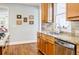 Bright kitchen showcases granite countertops, stainless sink, tile backsplash, and hardwood floors at 656 Gunby Se Rd, Marietta, GA 30067