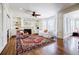 Inviting living room with a fireplace, built-in shelves, and large windows with natural light at 656 Gunby Se Rd, Marietta, GA 30067