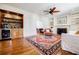 Elegant living room with a fireplace, built-in shelves, and a beverage bar at 656 Gunby Se Rd, Marietta, GA 30067