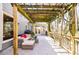 Inviting patio with shaded seating and decorative pergola, offering a relaxing outdoor space at 656 Gunby Se Rd, Marietta, GA 30067