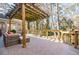 Inviting patio with shaded seating and decorative pergola, perfect for outdoor relaxation at 656 Gunby Se Rd, Marietta, GA 30067