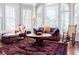 Bright sunroom with large windows, comfortable seating, and an antique rug at 656 Gunby Se Rd, Marietta, GA 30067