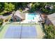 Aerial view of community amenities, including a pool, tennis court, and clubhouse at 95 Mount Vernon Cir, Atlanta, GA 30338