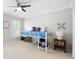 Cozy bedroom with a loft bed, ceiling fan, and a bright window at 95 Mount Vernon Cir, Atlanta, GA 30338