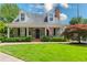 Charming home with a well-manicured lawn and traditional architectural details at 95 Mount Vernon Cir, Atlanta, GA 30338