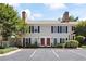 Charming two-story home featuring well-maintained landscaping, a classic facade, and convenient parking spaces at 95 Mount Vernon Cir, Atlanta, GA 30338