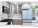 Bright kitchen boasts gray cabinets, stainless appliances, and marble countertops at 95 Mount Vernon Cir, Atlanta, GA 30338