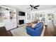 Bright living room features custom built-ins, a cozy fireplace, and an open view of the kitchen and dining area at 95 Mount Vernon Cir, Atlanta, GA 30338