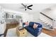 Cozy living room with hardwood floors and ceiling fan next to eat in kitchen at 95 Mount Vernon Cir, Atlanta, GA 30338