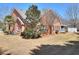 Expansive backyard showcases the brick home's architecture and mature landscaping at 1500 Elena Dr, Mcdonough, GA 30253