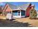 A brick patio and screened in porch in the backyard offer an outdoor relaxation space at 1500 Elena Dr, Mcdonough, GA 30253
