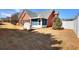 Brick patio and screened in porch offer outdoor relaxation space and fenced backyard provide privacy at 1500 Elena Dr, Mcdonough, GA 30253