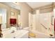 Bathroom features a tub/shower combo, cream vanity and taupe walls at 1500 Elena Dr, Mcdonough, GA 30253