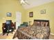 Bedroom featuring large window, ceiling fan, and en suite desk space at 1500 Elena Dr, Mcdonough, GA 30253