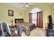 Bedroom featuring large window, ceiling fan, and en suite desk space at 1500 Elena Dr, Mcdonough, GA 30253