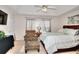 Bedroom featuring large window, ceiling fan, and accent chair at 1500 Elena Dr, Mcdonough, GA 30253
