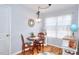 Cozy dining area with natural light and wood floors at 1500 Elena Dr, Mcdonough, GA 30253
