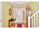 Inviting foyer showcasing hardwood floors, a stylish table and a decorative mirror at 1500 Elena Dr, Mcdonough, GA 30253