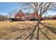 Charming brick home featuring a meticulously maintained lawn and inviting front entrance at 1500 Elena Dr, Mcdonough, GA 30253