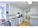 Bright kitchen showcases white cabinetry, gas range, and modern appliances at 1500 Elena Dr, Mcdonough, GA 30253