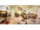 Open concept living room with fireplace, vaulted ceilings, and carpeted floors at 1500 Elena Dr, Mcdonough, GA 30253