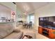 Open-concept living area with dining, kitchen, and media area; bathed in natural light at 1500 Elena Dr, Mcdonough, GA 30253