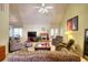 Spacious living room with a fireplace, plush seating, and abundant natural light at 1500 Elena Dr, Mcdonough, GA 30253