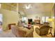 Open-concept living room featuring vaulted ceilings, a fireplace, and comfortable furnishings at 1500 Elena Dr, Mcdonough, GA 30253