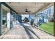 Covered back porch featuring string lights, comfortable seating, and a ceiling fan at 316 Cranmore Pl, Villa Rica, GA 30180