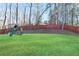 Spacious backyard with lush lawn and play structure at 316 Cranmore Pl, Villa Rica, GA 30180
