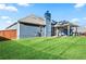 Well-manicured backyard with covered patio, perfect for outdoor entertaining at 316 Cranmore Pl, Villa Rica, GA 30180