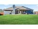 Expansive backyard featuring lush green lawn and a covered patio at 316 Cranmore Pl, Villa Rica, GA 30180