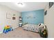 Bedroom with blue accent wall, truck decorations, and a comfortable twin bed at 316 Cranmore Pl, Villa Rica, GA 30180