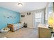 bedroom featuring a bright accent wall, twin bed, and playful decor at 316 Cranmore Pl, Villa Rica, GA 30180