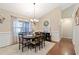 Dining room featuring hardwood floors and a chandelier at 316 Cranmore Pl, Villa Rica, GA 30180