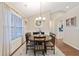Dining room featuring hardwood floors and a chandelier at 316 Cranmore Pl, Villa Rica, GA 30180