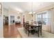 Open-concept dining room featuring hardwood floors, and large windows at 316 Cranmore Pl, Villa Rica, GA 30180