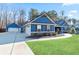 Blue home with a two-car garage and stone accents at 316 Cranmore Pl, Villa Rica, GA 30180